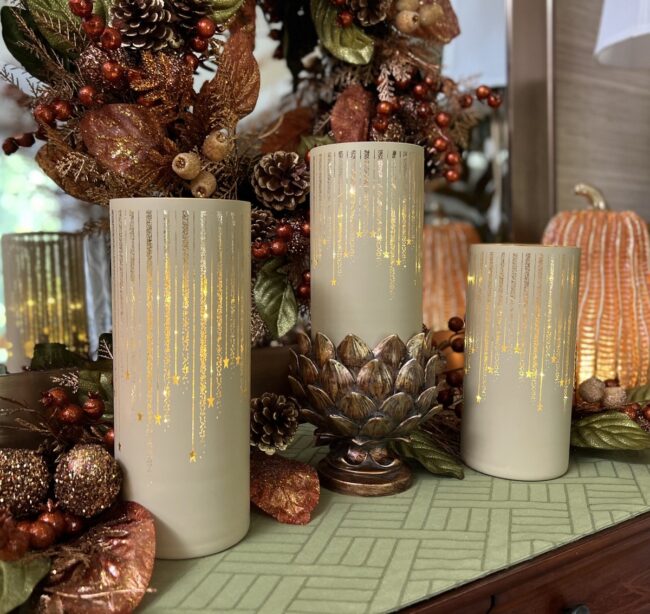Elegant Candles Paired with Golden Pinecones