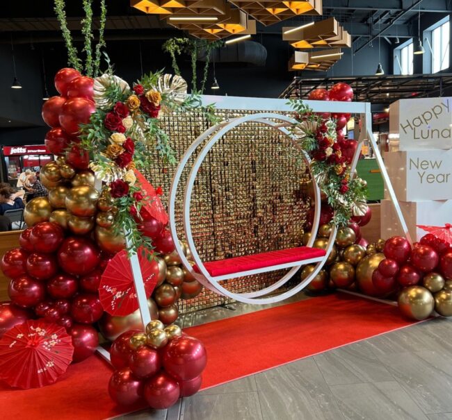 Stunning Red and Gold Balloon Floral Arch