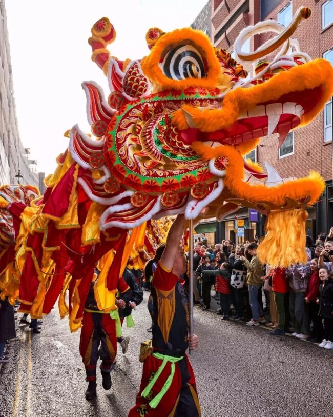 Dynamic Dragon Dance Ignites Urban Streets