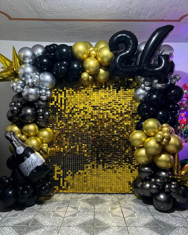 Radiant Golden Backdrop with Striking Balloon Arch